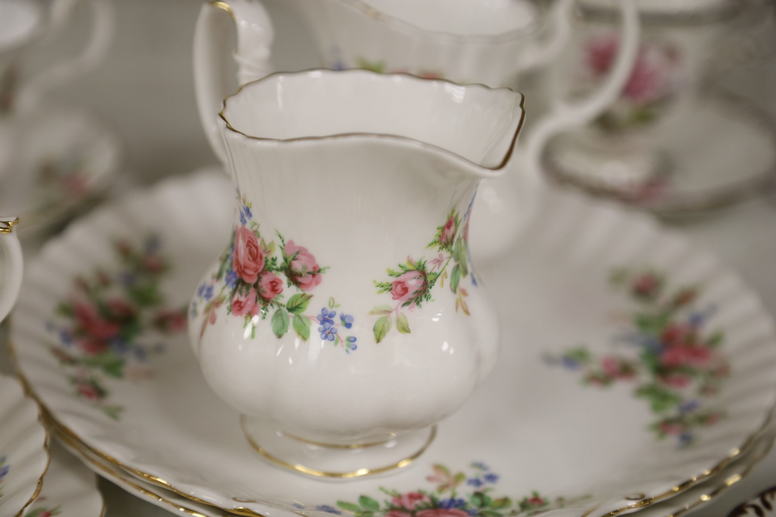 A Royal Albert Moss Rose pattern tea service (41-pce) and a set of four Coalport botanical cups and saucers